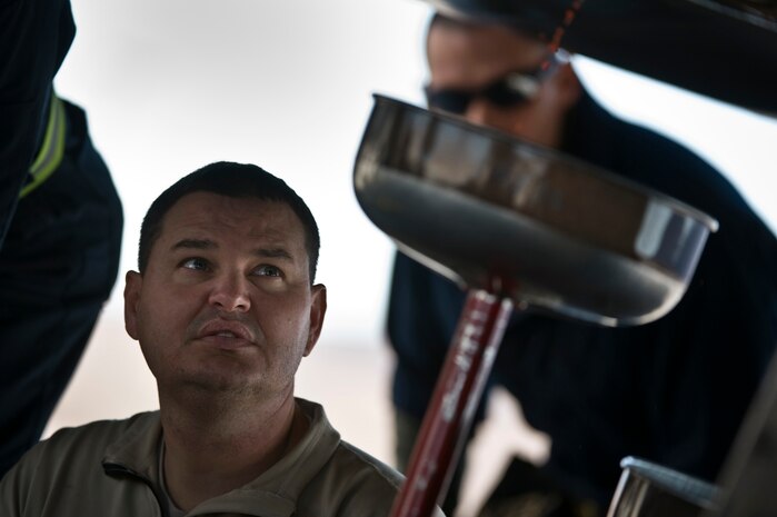 U.S. Air Force Tech. Sgt. Randy Blumer, 28th Aircraft Maintenance Squadron aircraft hydraulics systems craftsman, Ellsworth Air Force Base, S.D., inspects a hydraulic pump leak underneath a B-1B Lancer during Red Flag 12-2 Jan. 24, 2012, at Nellis AFB, Nev. Red Flag is a realistic combat training exercise involving the air forces of the United States and its allies. The exercise is hosted north of Las Vegas on the Nevada Test and Training Range. (U.S. Air Force photo by Senior Airman Brett Clashman)