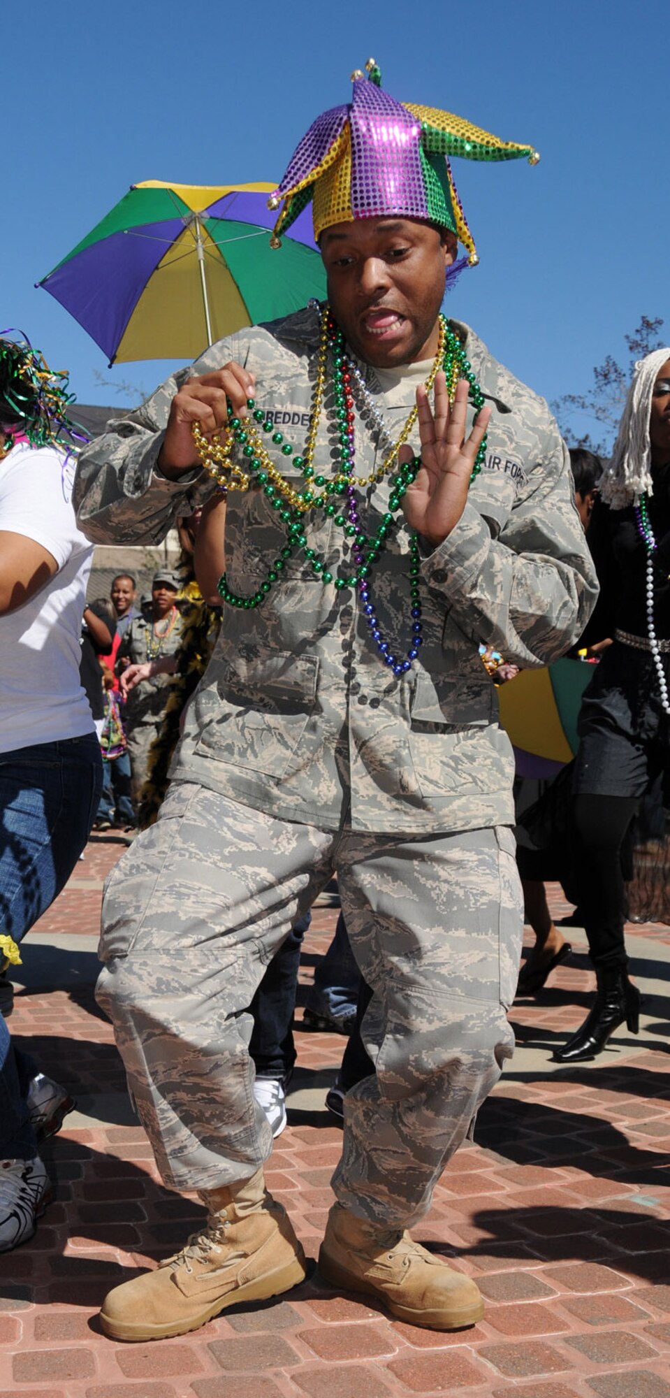 Tech. Sgt. Douglas Dredden, 336th Training Squadron, Keesler Air Force Base Miss., dances at his unit’s Mardi Gras parade, March 1, 2011.  The Red Wolves have invited the rest of the 81st Training Group to participate in this year’s parade in the courtyard between Thomson, Cody and Matero Halls at 1:30 p.m. Feb. 10.  (U.S. Air Force photo by Kemberly Groue)