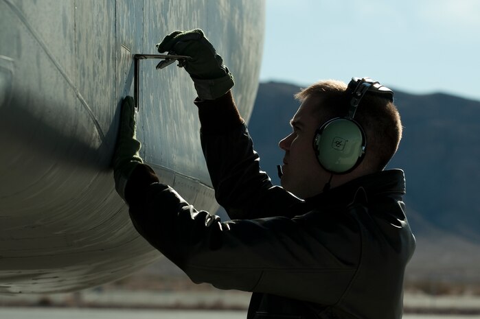 U.S. Air Force Capt. Gregory Marcus, 37th Bomber Squadron pilot, conducts a pre-flight inspection on a B-1B Lancer, Ellsworth Air Force Base, S.D., during Red Flag 12-2 Jan. 24, 2012, at Nellis AFB, Nev. Red Flag is a realistic combat training exercise involving the air forces of the United States and its allies. The exercise is hosted north of Las Vegas on the Nevada Test and Training Range. (U.S. Air Force photo by Staff Sgt. Christopher Hubenthal)
