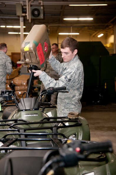U.S. Air Force Senior Airmen Edward Young, 820th Combat Operations Squadron security forces, fuels all-terrain vehicles at Moody Air Force Base, Ga., Jan. 24, 2012. Part of Young’s job is to also check and validate the ATVs’ registration numbers to confirm the right vehicles are turned in after their use. (U.S. Air Force Photo by Airmen 1st Class Paul Francis/Released)
