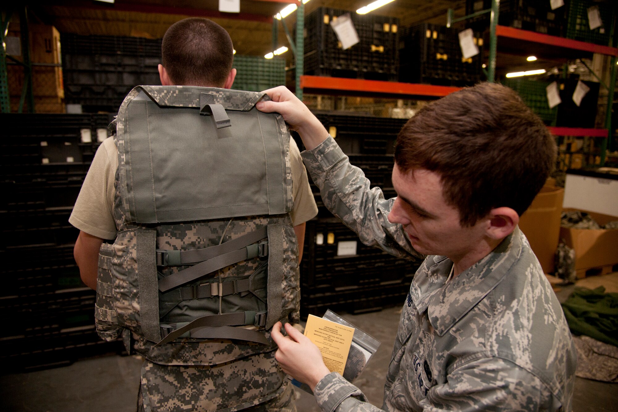 U.S. Air Force Senior Airmen Edward Young, 820th Combat Operations Squadron security forces, inspects flack vest’s ripcord at Moody Air Force Base, Ga., Jan. 24, 2012. The ripcord dismantles the vest in case of emergencies for easy removal. (U.S. Air Force Photo by Airmen 1st Class Paul Francis/Released)
