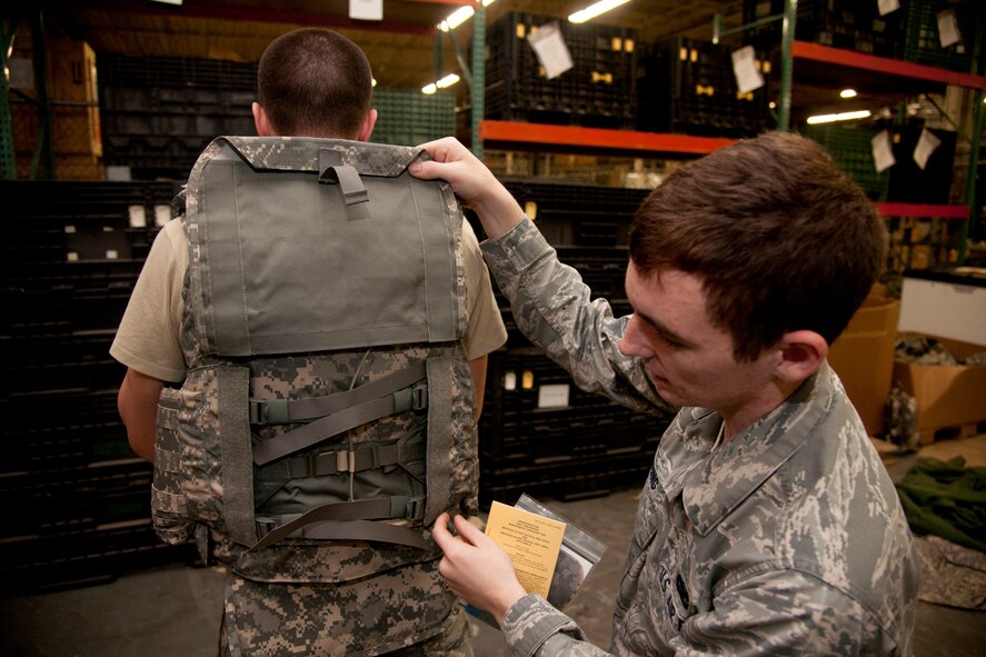 U.S. Air Force Senior Airmen Edward Young, 820th Combat Operations Squadron security forces, inspects flack vest’s ripcord at Moody Air Force Base, Ga., Jan. 24, 2012. The ripcord dismantles the vest in case of emergencies for easy removal. (U.S. Air Force Photo by Airmen 1st Class Paul Francis/Released)
