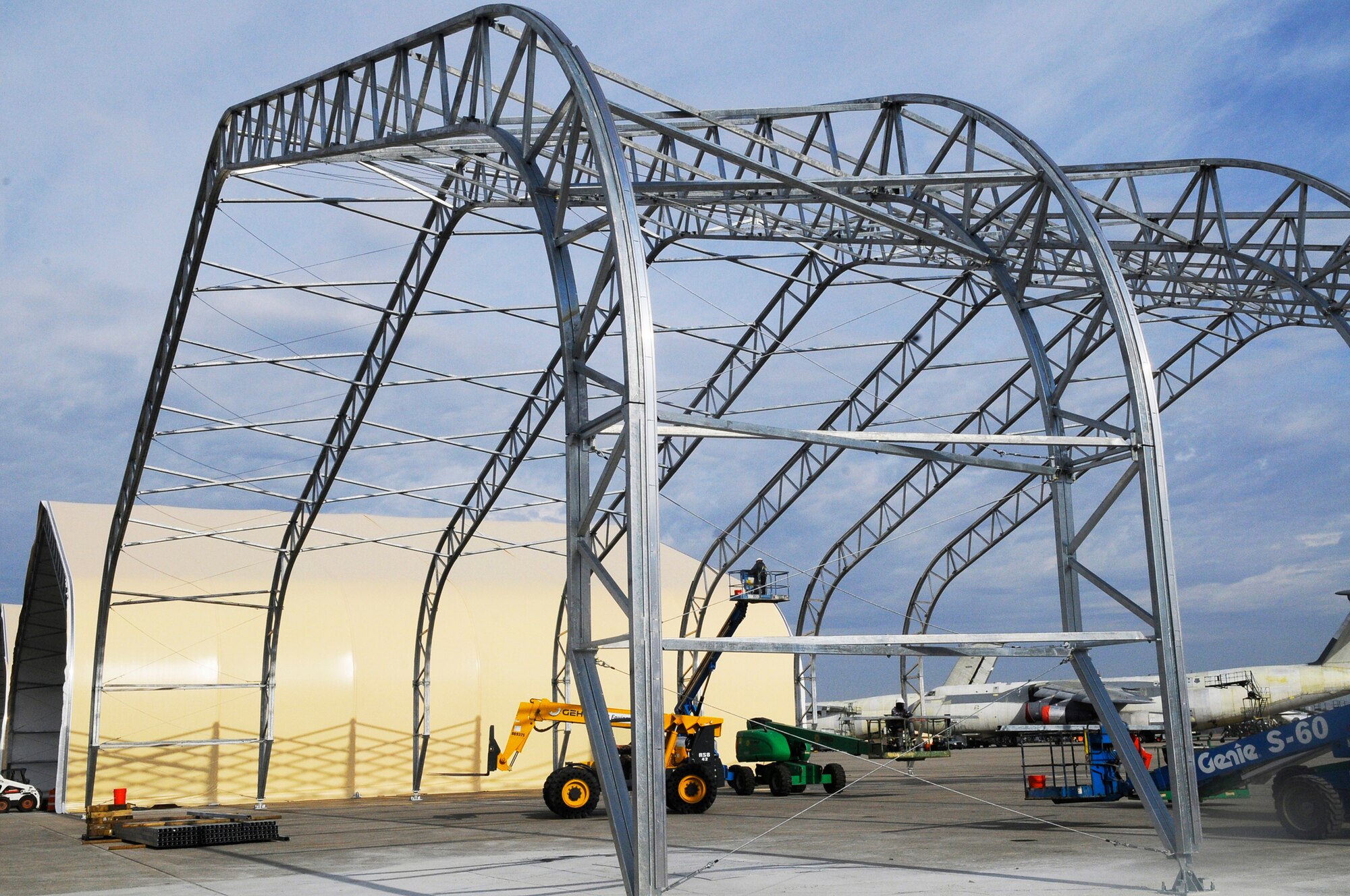 The construction of new steel and fabric structures to house C-130 aircraft is on schedule to be completed by this summer. U. S. Air Force photo by Sue Sapp