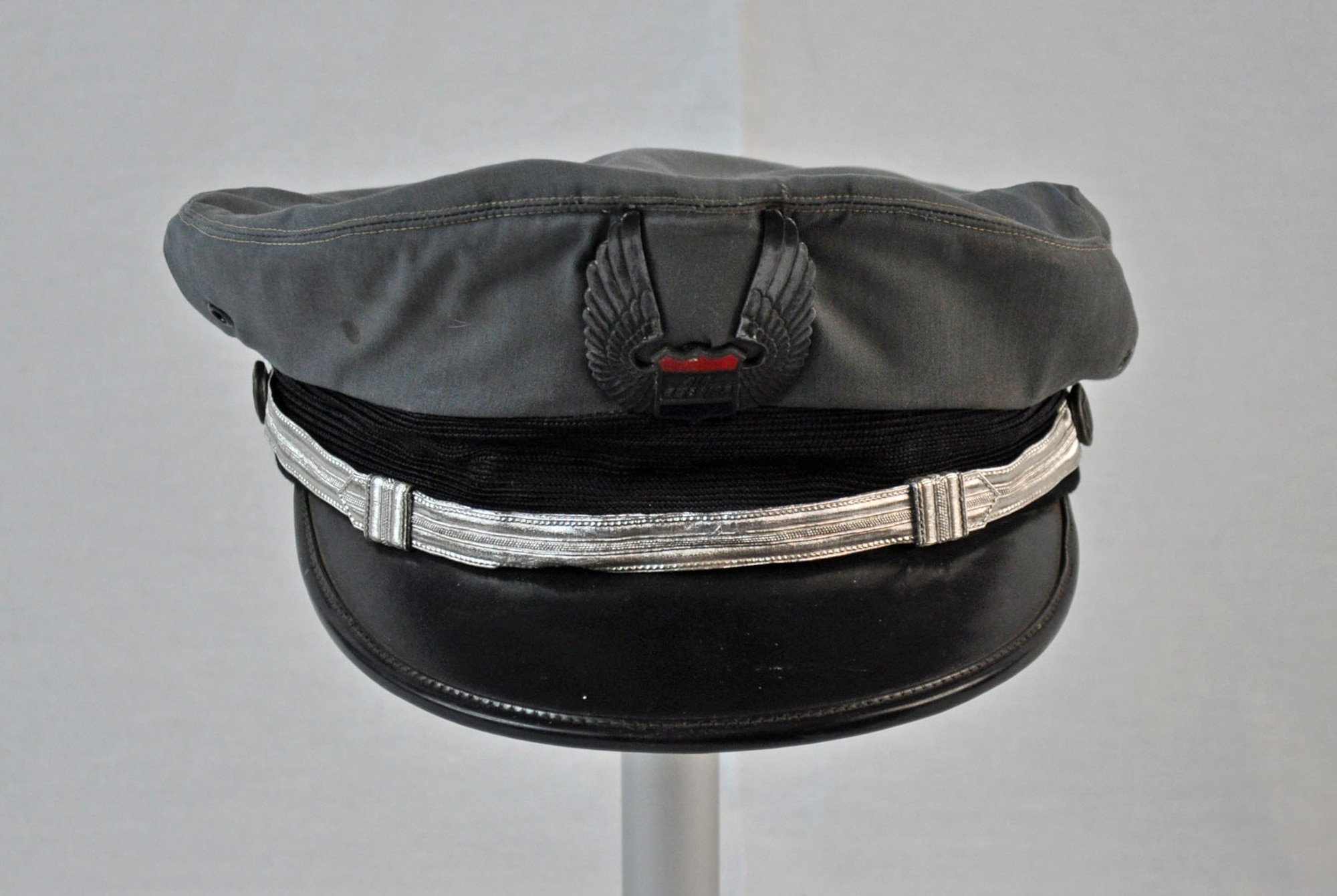 This cap was worn by the donor's father, Carmen Sylvester, who was an Air America pilot in Vietnam and Laos from 1966-1969. Air America was a secretly owned/operated CIA passenger and cargo airline. The uniform cap represents the type primarily worn in Laos by Air America pilots. (U.S. Air Force photo)