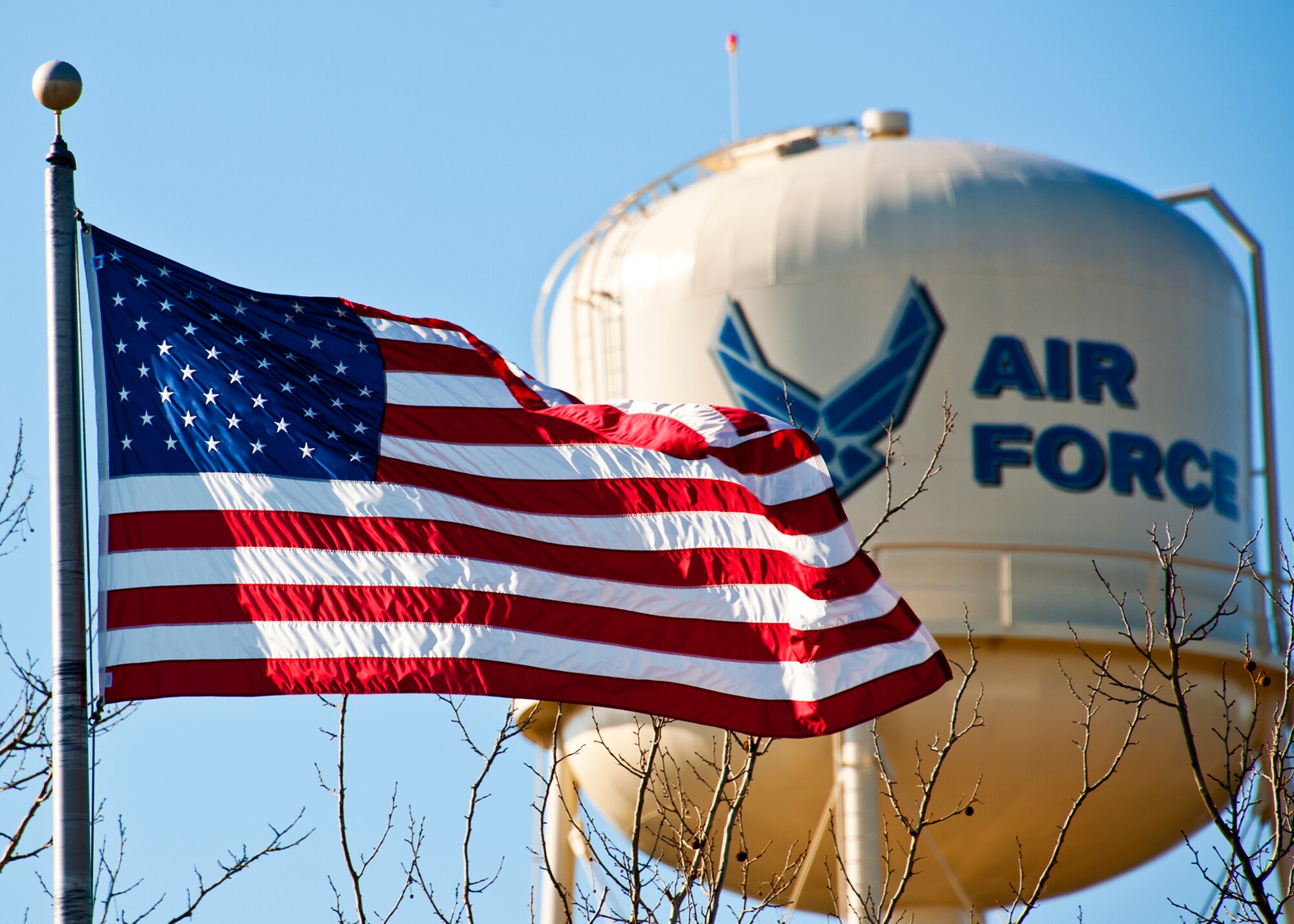 The American flag ripples in the breeze in front of the 919th Special Operations Wing headquarters building and water tower at Duke Field, Fla. Jan. 26.  (U.S. Air Force photo/Tech. Sgt. Samuel King Jr.)