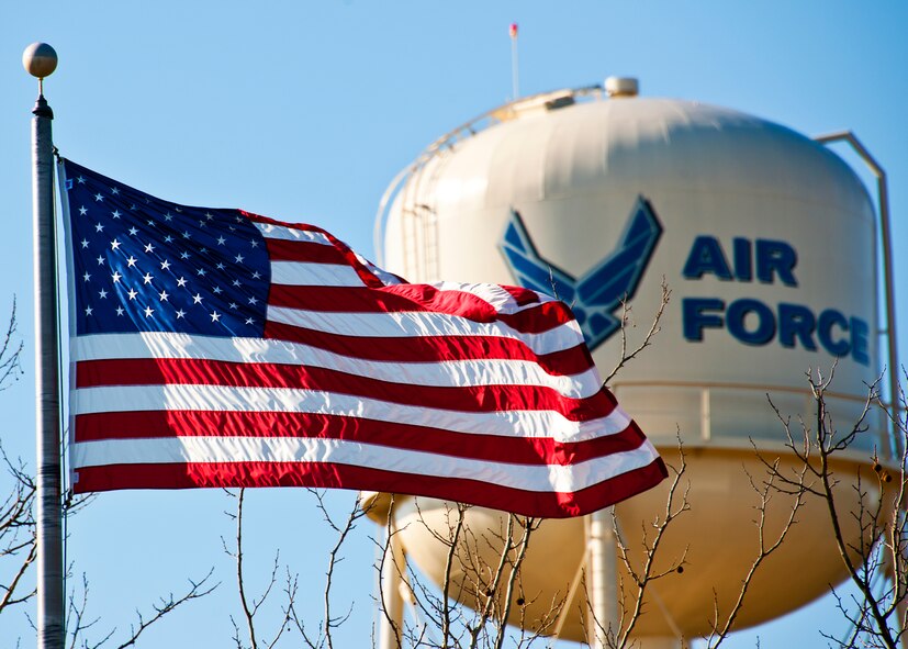 The American flag ripples in the breeze in front of the 919th Special Operations Wing headquarters building and water tower at Duke Field, Fla. Jan. 26.  (U.S. Air Force photo/Tech. Sgt. Samuel King Jr.)