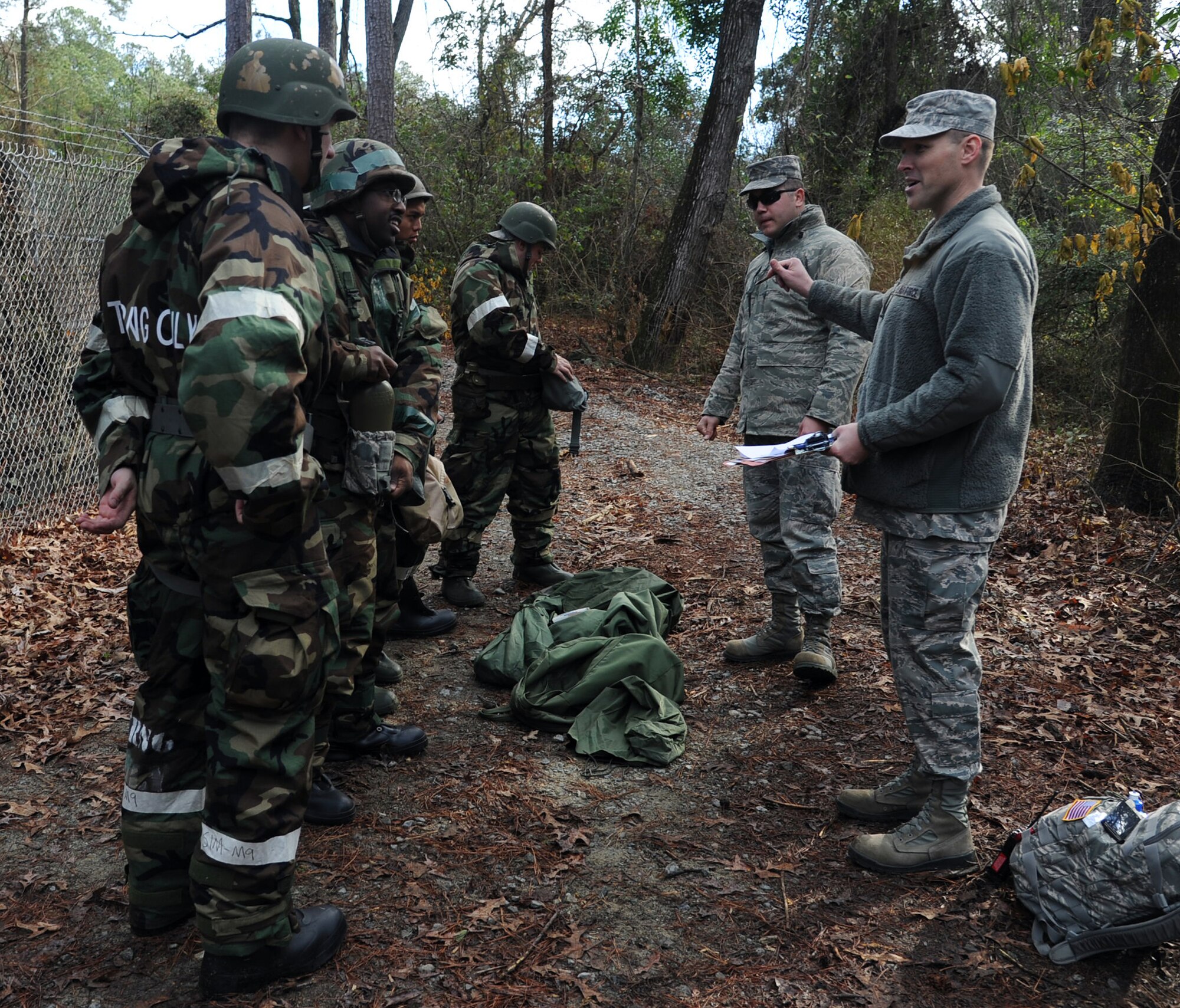 Master Sgt. Danny Kates quizzes Airmen about correct personal protective equipment wear during Ability to Survive and Operate Rodeo training on Seymour Johnson Air Force Base, N.C., Jan. 25, 2012. An exercise evaluation team inspects each Airman’s personal protective equipment gear for correct marking and verifies their protective mask fit test. Kates is a 4th Fighter Wing exercise evaluation team member from Richmond, Ind. (U.S. Air Force photo/Senior Airman Whitney Stanfield)  