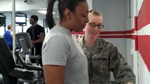 Tech. Sgt. Crystal Frazier (right) weighs Staff Sgt. April Ruffin on Jan. 26, 2012 at the Seymour Johnson Health and Wellness Center. Ruffin is one of the participants in the base's Biggest Loser Competition that begins this week and goes through the end of April. (USAF photo by Maj. Shannon Mann, 916ARW/PA)