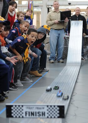RAF MILDENHALL, ENGLAND – Spectators watch during the Pinewood Derby at the Exchange here Jan. 21, 2012. The event is held annually by Pack 215 of the Boy Scouts of America and challenges scouts at the base to build and race their own cars.  (U.S. Air Force photo by Tech. Sgt. Neal Joiner)