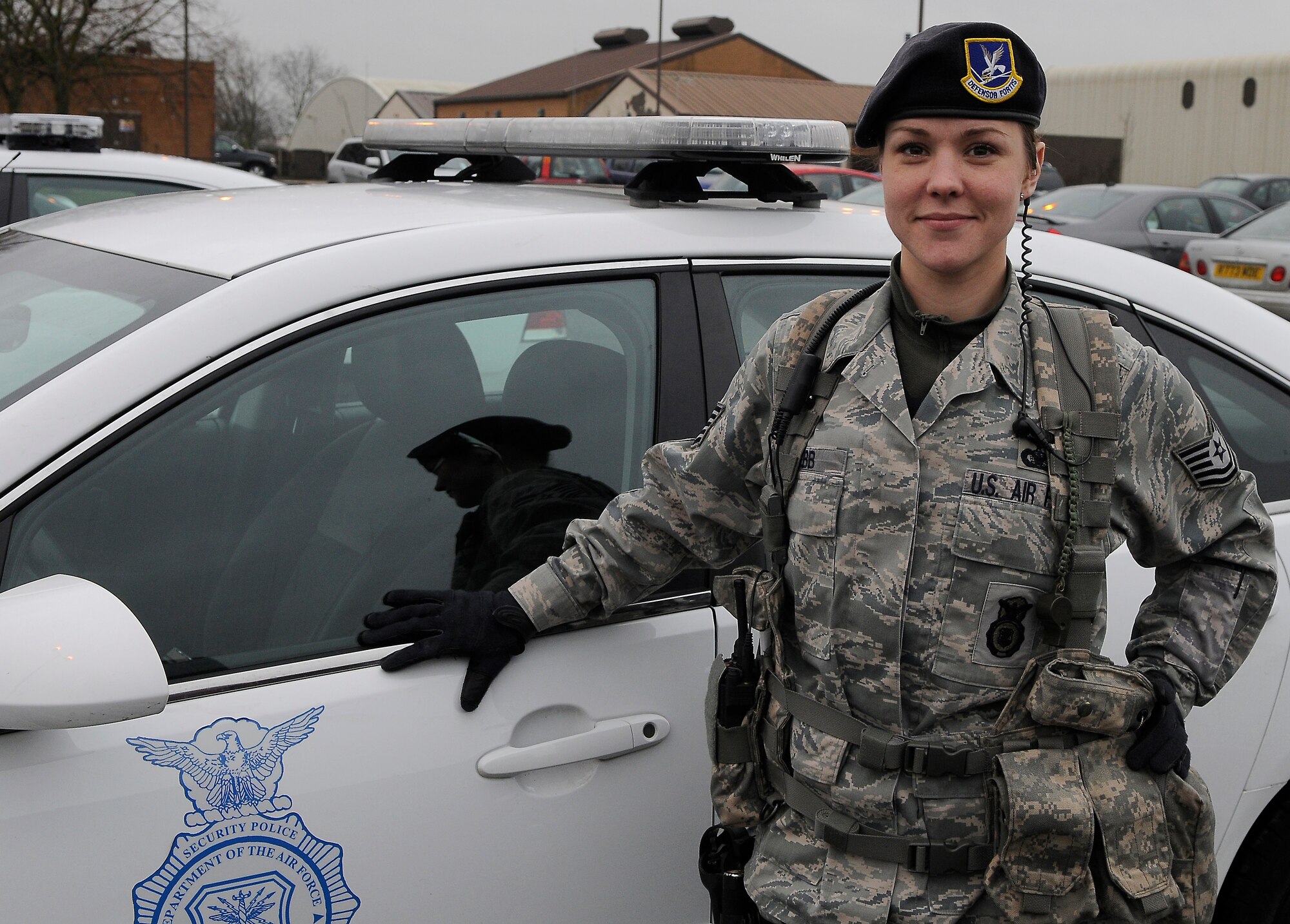 ROYAL AIR FORCE LAKENHEATH, England -- Tech. Sgt.  Samantha Webb, 48th Security Forces Squadron flight chief, prepares to go on patrol at the 48th SFS headquarters building, Jan. 18, 2011.  Webb has been in the Air Force for 11 years, stationed at RAF Lakenheath since August 2008 and has deployed five times.  (U.S. Air Force photo by Staff Sgt. Connor Estes)