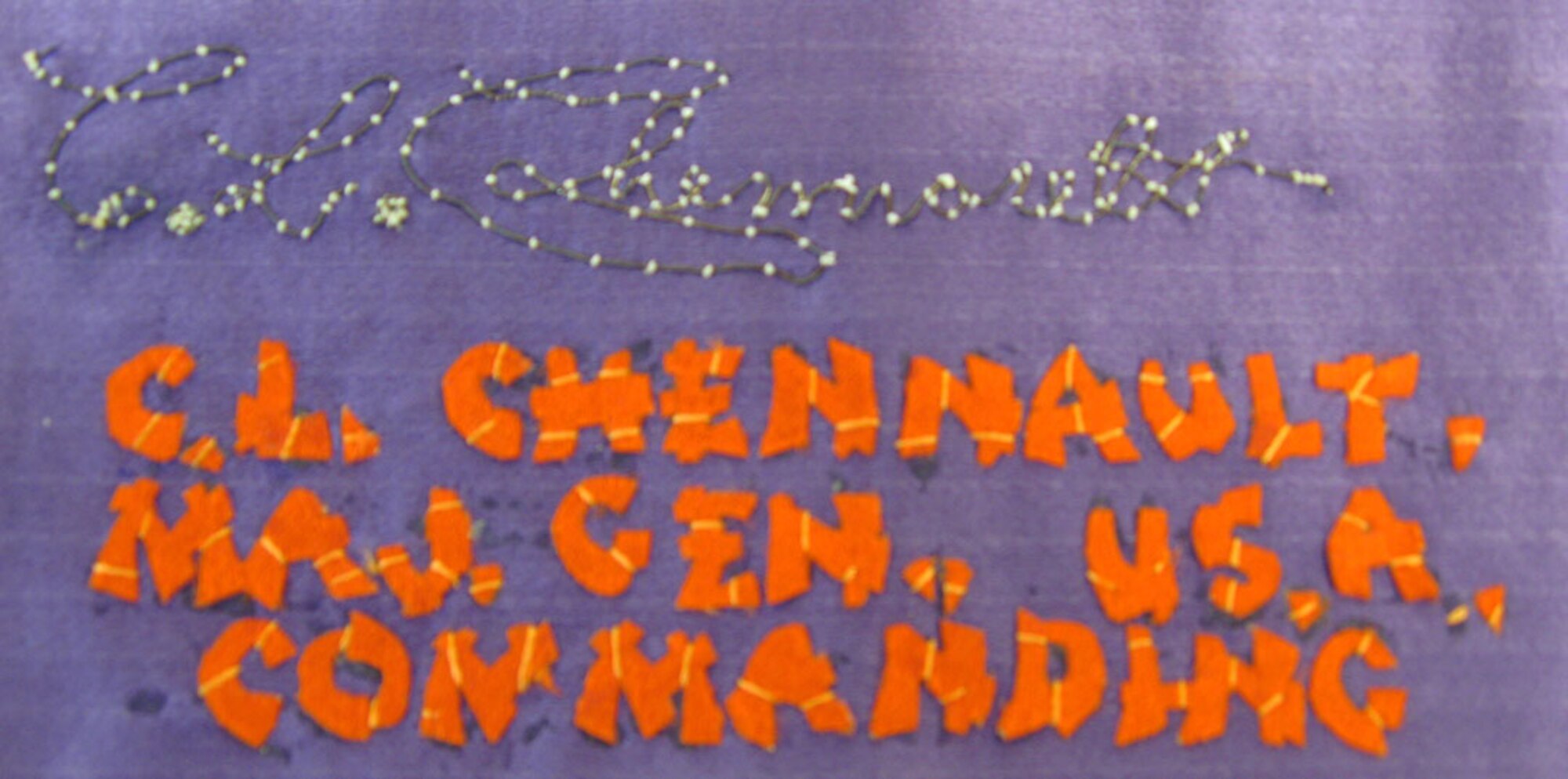 This banner was awarded to the donor's father, Howard Arnegard, for the winning design in Maj. Gen. Claire Chennault's contest for the 14th Air Force insignia. It was made in 1944 in China. The Chinese lettering translates to the English wording on the banner. (U.S. Air Force photo)