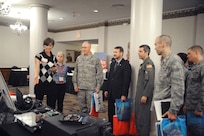 Ashley Cook, Corning Cable Systems Sales engineer, explainsthe versatility of the company's fiber optics to personnel from Joint Base San Antonio-Randolph during the Technology Expo held at the JBSA-Randolph Parr club Jan. 24. (U.S. Air Force photo/Rich McFadden) (released)