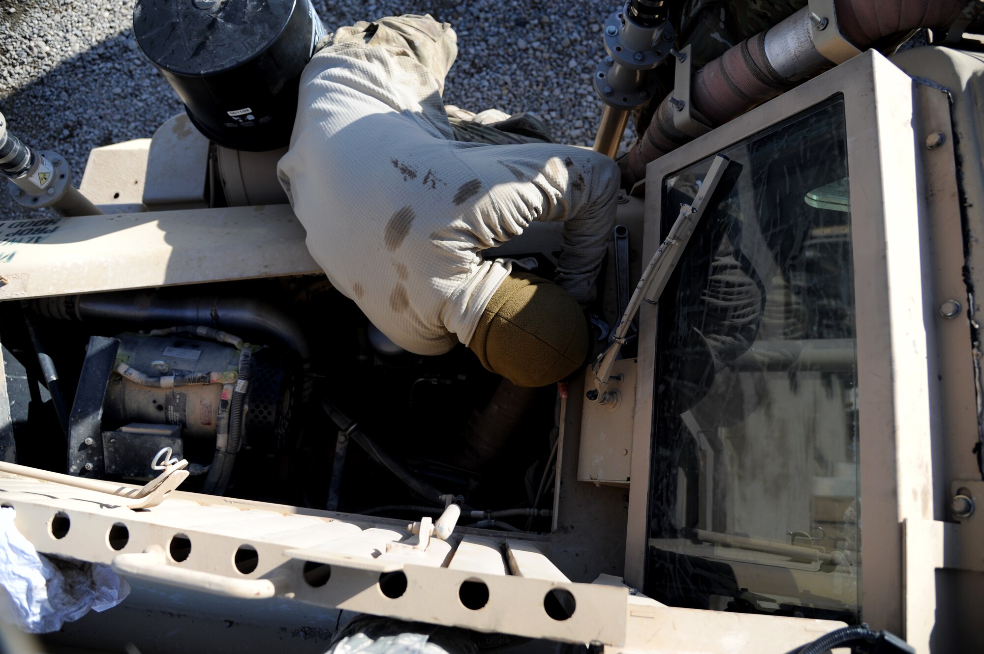 MAIN OPERATING BASE LEATHERNECK, Afghanistan -- Tech. Sgt. Jason Lubas, a vehicle mechanic assigned to the 466th Explosive Ordnance Disposal Flight, Operating Location-Delta, works on a Mine Resistant Ambush Protected vehicle. Lubas's mission is to maintain the 26 MRAP vehicles that keep the OL-D EOD technicians on the road. He is deployed from Dyess Air Force Base, Texas. (U.S. Air Force photo/Senior Airman Tyler Placie)