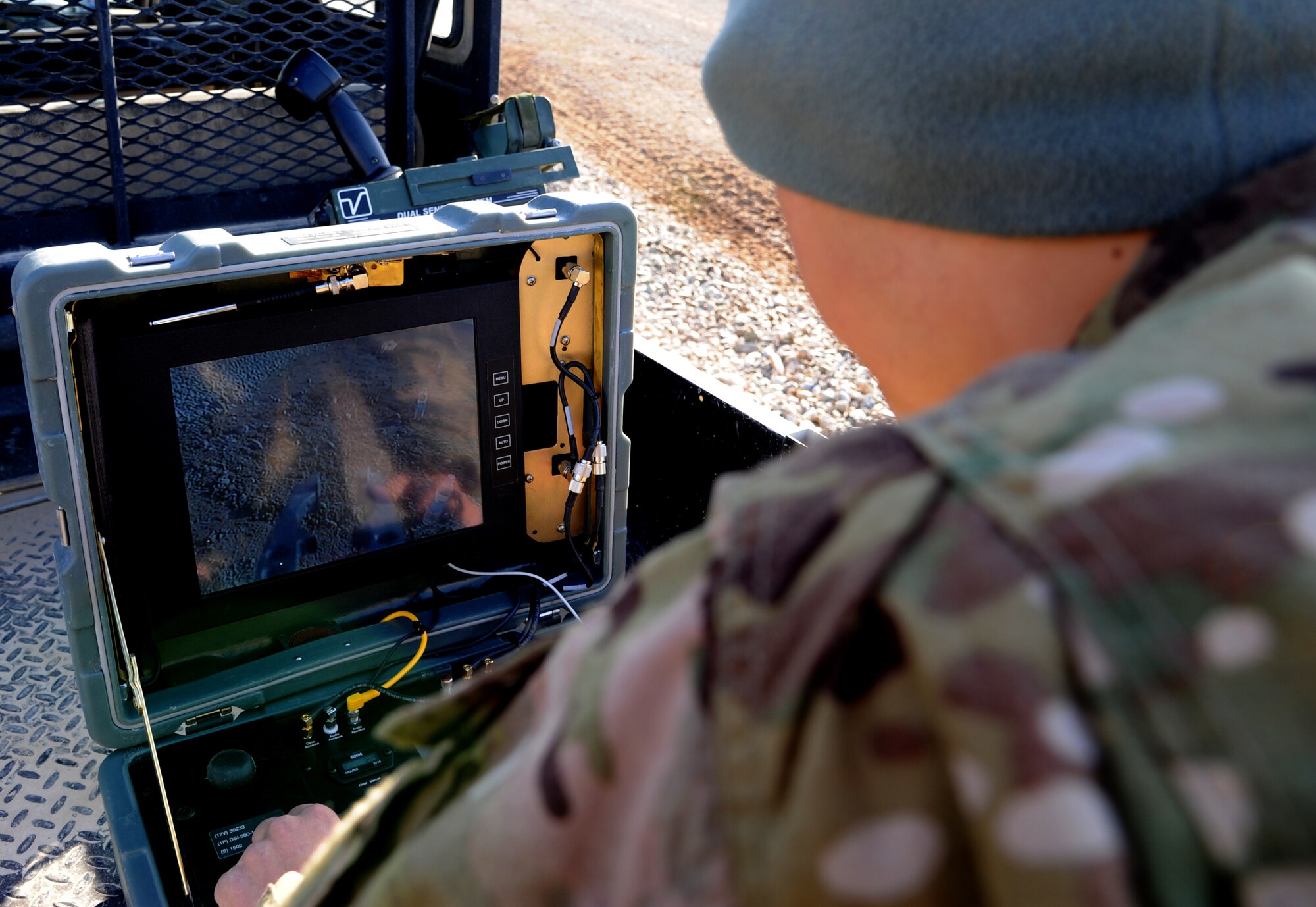 MAIN OPERATING BASE LEATHERNECK, Afghanistan -- Airman 1st Class Seth Reinhart, an Explosive Ordnance Disposal technician from the 466th EOD Flight, Operating Location-Delta, trains for a mission using a computer that controls a robot which can be used by an EOD team to get close to suspected Improvised Explosive Devices while they stay protected in an armored vehicle. The mission of the Airmen of OL-D is primarily focused on countering the IED threat, destroying enemy caches and munitions stockpiles, and responding to threats of indirect fire. (U.S. Air Force photo/Senior Airman Tyler Placie)