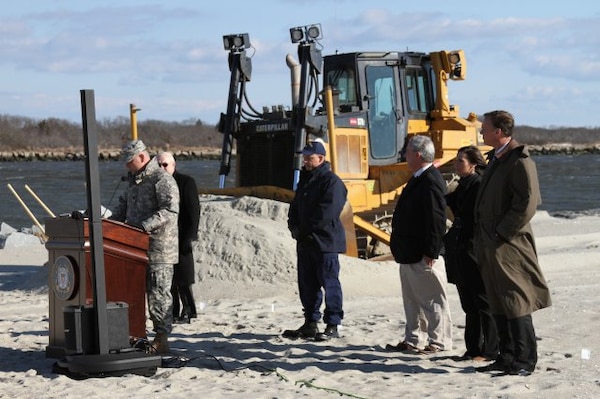 Lt. Col. Philip Secrist, U.S. Army Corps of Engineers Philadelphia district commander, speaks about the Cape May beach nourishment project along with representatives from Cape May, New Jersey Department of Environment Protection, the U.S. Coast Guard, and Congressional staff for Congressman Frank LoBiondo and Senator Frank R. Lautenberg. The $9 million project placed approximately 600,000 cubic yards of sand onto the beach and was cost shared by USACE, the Coast Guard, NJDEP and Cape May City.