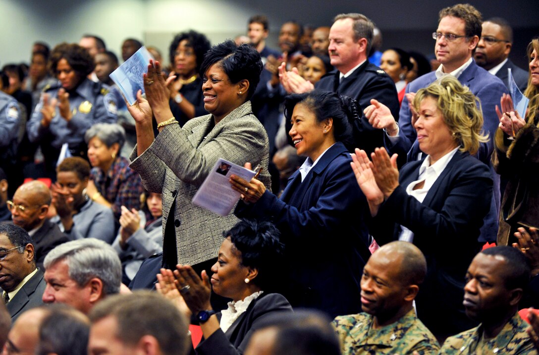 Audience members deliver a standing ovation as keynote speaker Rev. Samuel "Billy" Kyles completes his address during the 27th annual ceremony to honor Martin Luther King Jr. at the Pentagon, Jan. 26, 2012.