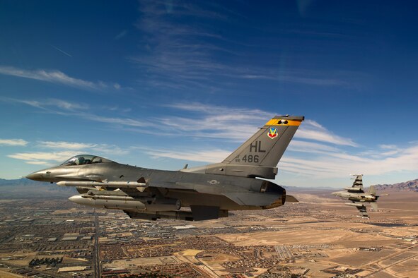 Capt. Mike Broderick (right) breaks from Capt. Brandon Lavalley on the final approach during day three of Red Flag 12-2 Jan. 25 at Nellis Air Force Base, Nev. (U.S. Air Force Photo by Master Sgt. Ben Bloker)