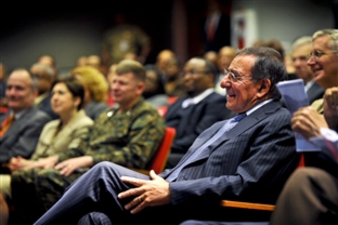 Defense Secretary Leon E. Panetta watches as keynote speaker Rev. Samuel "Billy" Kyles, a civil rights activist, speaks about the day Martin Luther King Jr. was assassinated during the 27th annual ceremony to honor King at the Pentagon, Jan. 26, 2012.