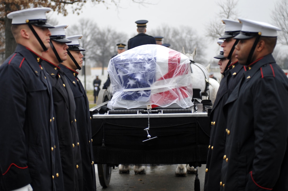 Marine Corps Body Bearers from Marine Barracks Washington prepare to unload the casket of Gen. Samuel Jaskilka (1919-2012), the 16th assistant commandant of the Marine Corps, at Arlington National Cemetery in Arlington, Va., Jan. 26. Jaskilka joined the Marine Corps reserves as a second lieutenant in 1942 and served as the assistant commandant from 1975 until he retired in 1978. Jaskilka was also honored with a flyover of four MV-22 Ospreys during the ceremony. Jaskilka’s awards include the Navy Distinguished Service Medal, two Silver Star Medals, a Legion of Merit, a Bronze Star Medal with a valor device, a World War II Victory Medal, seven Vietnam Service Medals and a United Nations Korea Medal.::r::::n::
