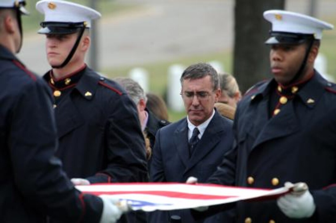 Mark Jaskilka grieves for his father, Gen. Samuel Jaskilka (1919-2012), at his funeral ceremony at Arlington National Cemetery in Arlington, Va., Jan. 26. Jaskilka served as assistant commandant of the Marine Corps from 1975 to 1978. Jaskilka’s awards include the Navy Distinguished Service Medal, two Silver Star Medal, a Legion of Merit, a Bronze Star Medal with a valor device, a World War II Victory Medal, seven Vietnam Service Medals and a United Nations Korea Medal. Jaskilka joined the Marine Corps reserves as a second lieutenant in 1942 and served as the assistant commandant from 1975 until he retired in 1978. Jaskilka was also honored with a flyover of four MV-22 Ospreys during the ceremony.
