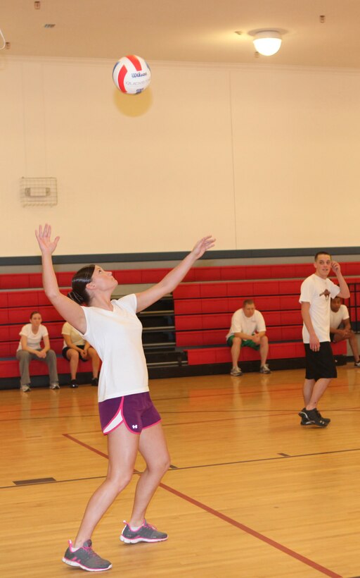 Cpl. Brittany Carmon, a finance technician with Company A, Headquarters and Support Battalion, Marine Corps Base Camp Lejeune, serves a volleyball during HQSPTBn. Commander’s Cup Challenge, held at the Area 1 Gym aboard MCB Camp Lejeune, Jan. 27. Each team played with vigor, but in the end it was Company A who won the tournament undefeated, providing them their third trophy in the series of sports tournaments held by HQSPTBn.::r::::n::