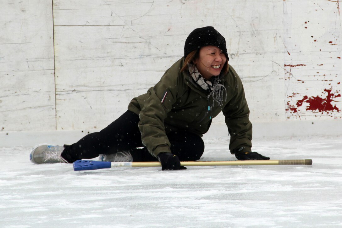 Gunnery Sgt. Alice Park, Recruiting Substation Duluth, cringes in pain after slipping on the ice during the 2012 Recruiting Station Twin Cities broom ball tournament Jan. 27. For additional imagery from the event, visit www.facebook.com/rstwincities.