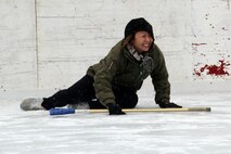 Gunnery Sgt. Alice Park, Recruiting Substation Duluth, cringes in pain after slipping on the ice during the 2012 Recruiting Station Twin Cities broom ball tournament Jan. 27. For additional imagery from the event, visit www.facebook.com/rstwincities.