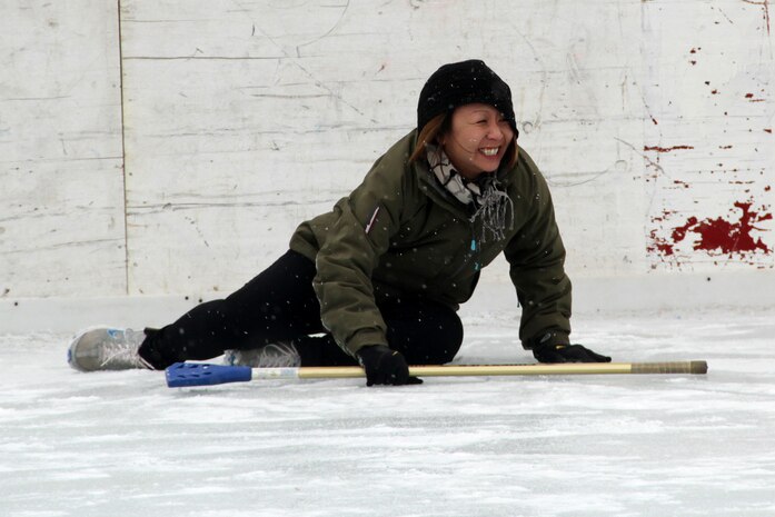 Gunnery Sgt. Alice Park, Recruiting Substation Duluth, cringes in pain after slipping on the ice during the 2012 Recruiting Station Twin Cities broom ball tournament Jan. 27. For additional imagery from the event, visit www.facebook.com/rstwincities.