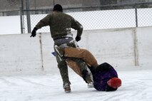 Marines with Recruiting Substations Woodbury and St. Cloud get tangled up during the 2012 Recruiting Station Twin Cities broom ball tournament Jan. 27. For additional imagery from the event, visit www.facebook.com/rstwincities.