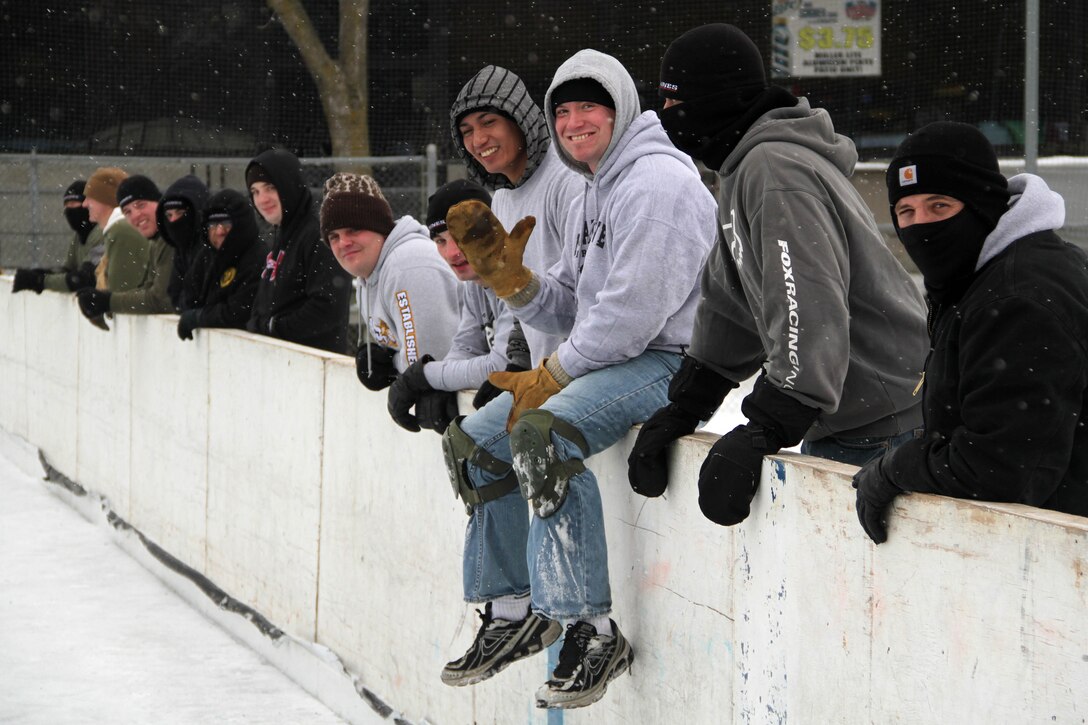 Marines from recruiting substations in the Dakotas, Minnesota and Western Wisconsin wait for their team to take the ice during the 2012 Recruiting Station Twin Cities broom ball tournament Jan. 27. For additional imagery from the event, visit www.facebook.com/rstwincities.