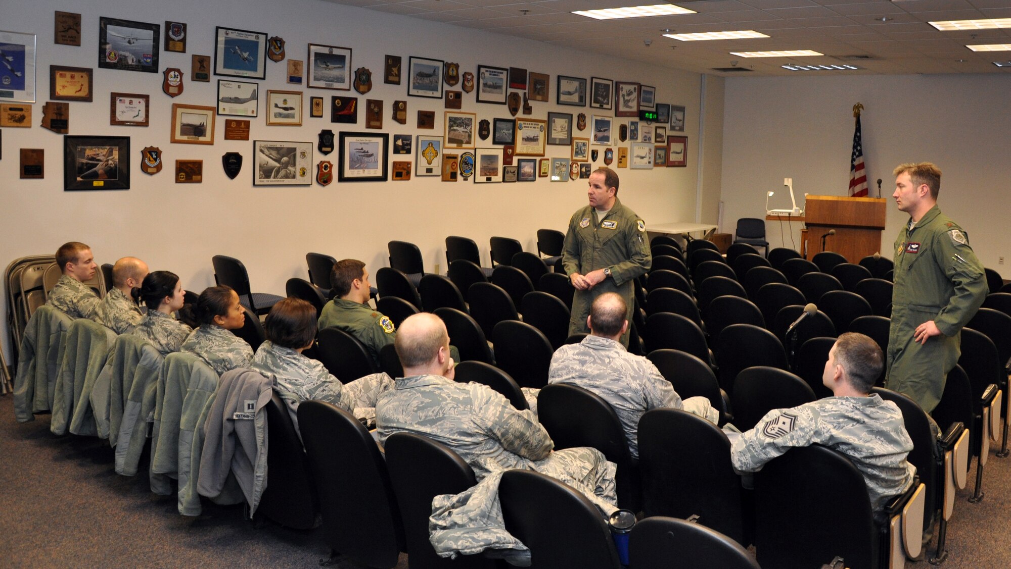 Lt. Col. James Suhr, 3rd Operations Support Squadron commander and Maj. Christopher Miller, chief of Wing Weapons brief members of the 673rd Legal office and the Army Chaplain corps about what takes place during War Day. Miller, a Reservist assigned to the 302nd Fighter Squadron, led the scenario planning effort for the exercise. (U.S. Air Force photo/Capt. Ashley Conner) 