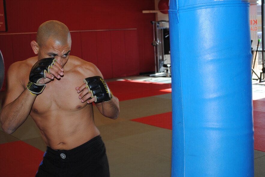 KIRTLAND AFB, N.M. -- Master Sgt. William Moore, 898th Munitions Squadron first sergeant, trains at a local gym Jan. 19. Moore won his second professional mixed martial arts fight Jan. 14 at the “King of the Cage” fight at the Buffalo Thunder Resort in Santa Fe. (Photo by Stefan Bocchino)