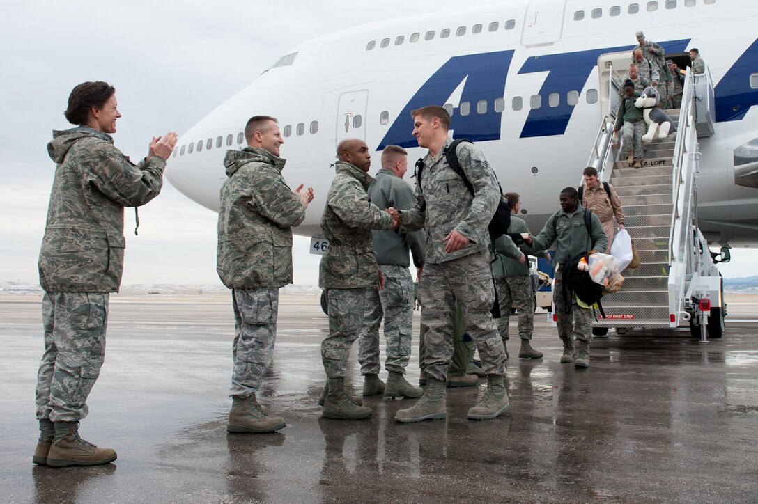 Leadership greeted Airmen of the 28th Bomb Wing as they return home following a six-month deployment to Southwest Asia, during a homecoming event at Ellsworth Air Force Base, S.D., Jan. 25, 2012. More than 400 Ellsworth Airmen supported operations in the region with critical air presence, precision strike, surveillance and reconnaissance. (U.S. Air Force photo by Airman 1st Class Kate Thornton/Released)