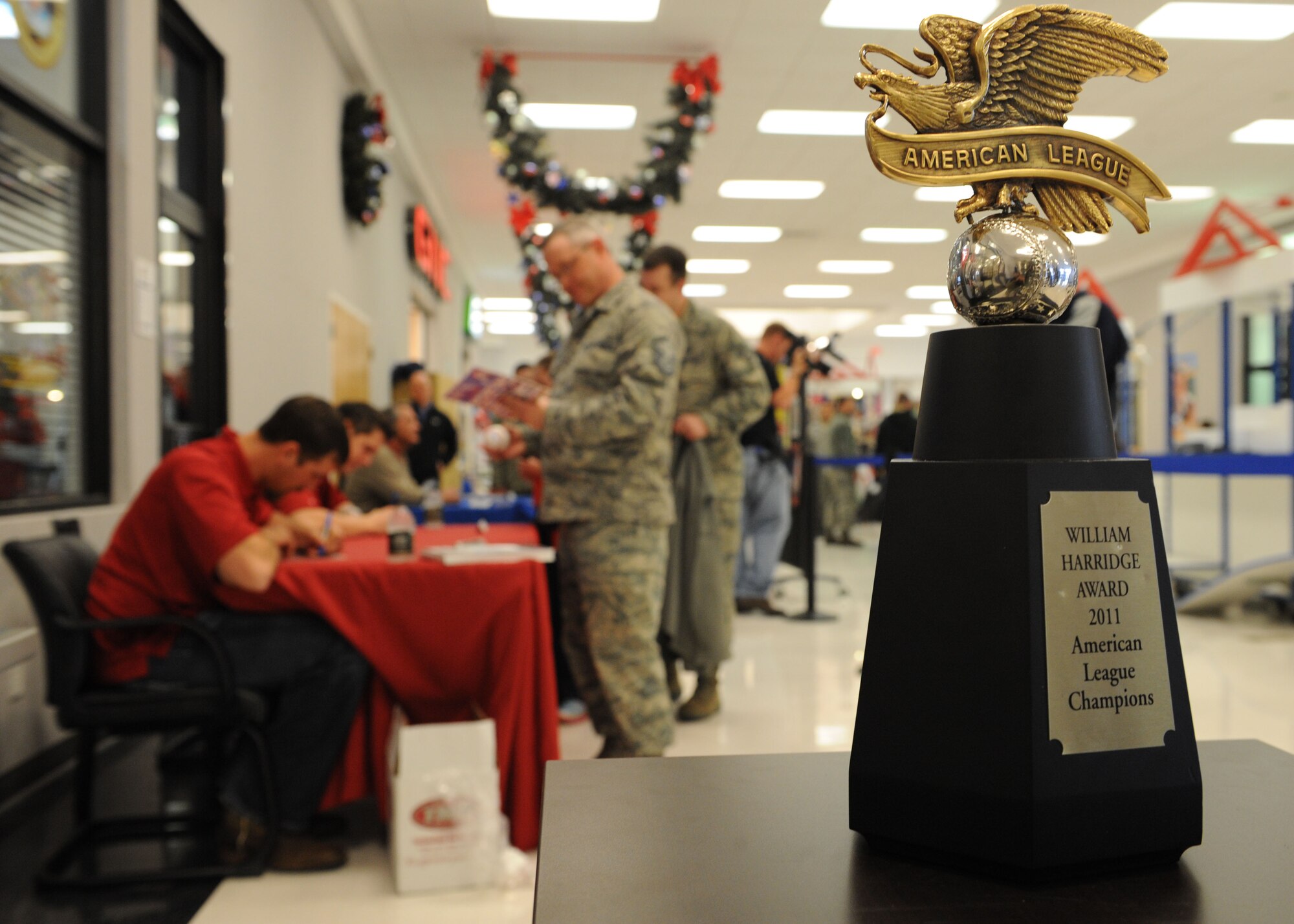 The Texas Rangers sign autographs for airmen during a base tour, Jan. 25, 2012, at Dyess Air Force Base, Texas. The Rangers visit multiple bases in Texas annually to sign autographs and meet military personnel. (U.S. Air Force photo by Airman 1st Class Jonathan Stefanko/Released)