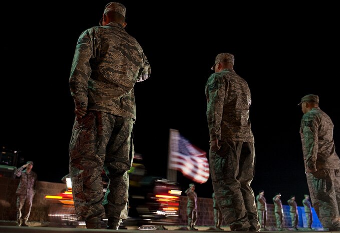 Nellis Airmen salute U.S. Marine Corps Cpl. Jon-Luke Bateman during his dignified arrival Jan. 25, 2012, at Nellis Air Force Base, Nev. Bateman, 22, of Pahrump, Nev., was an infantryman assigned to 2nd Battalion, 4th Marines, 1st Marine Division, Camp Pendleton, Calif. He was killed while serving his second combat deployment. (U.S. Air Force photo by Staff Sgt. Christopher Hubenthal)