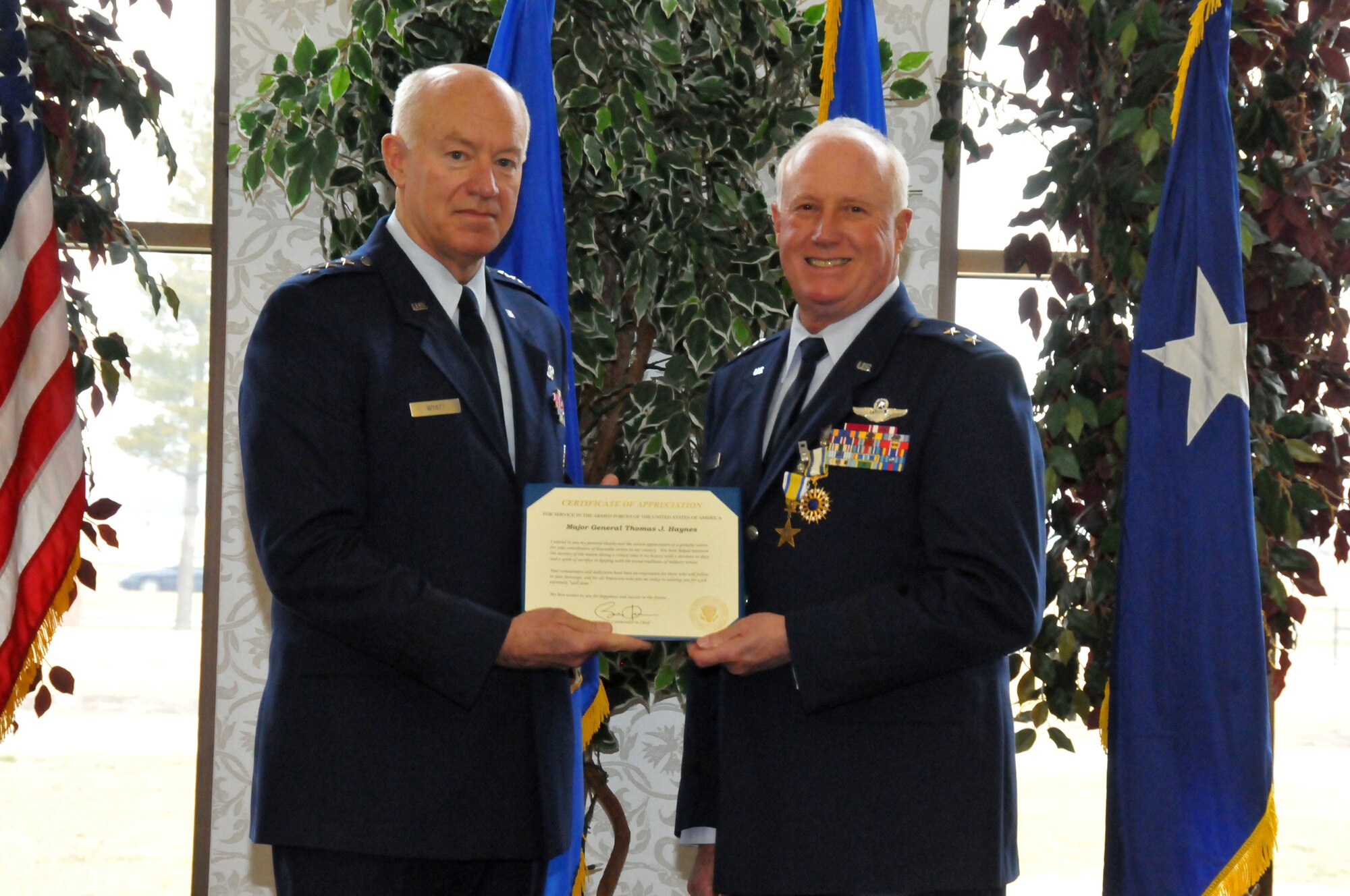 Lt. Gen. Harry M. Wyatt III (left) presents a Certificate of Appreciation to Maj. Gen. Thomas J. Haynes, Air National Guard Assistant to the Commander, Air Mobility Command, during Maj. Gen. Haynes' retirement ceremony at Scott AFB, Ill., on Jan. 27, 2012. The letter is signed by President Barack Obama extending the thanks of a grateful nation for his honorable service.