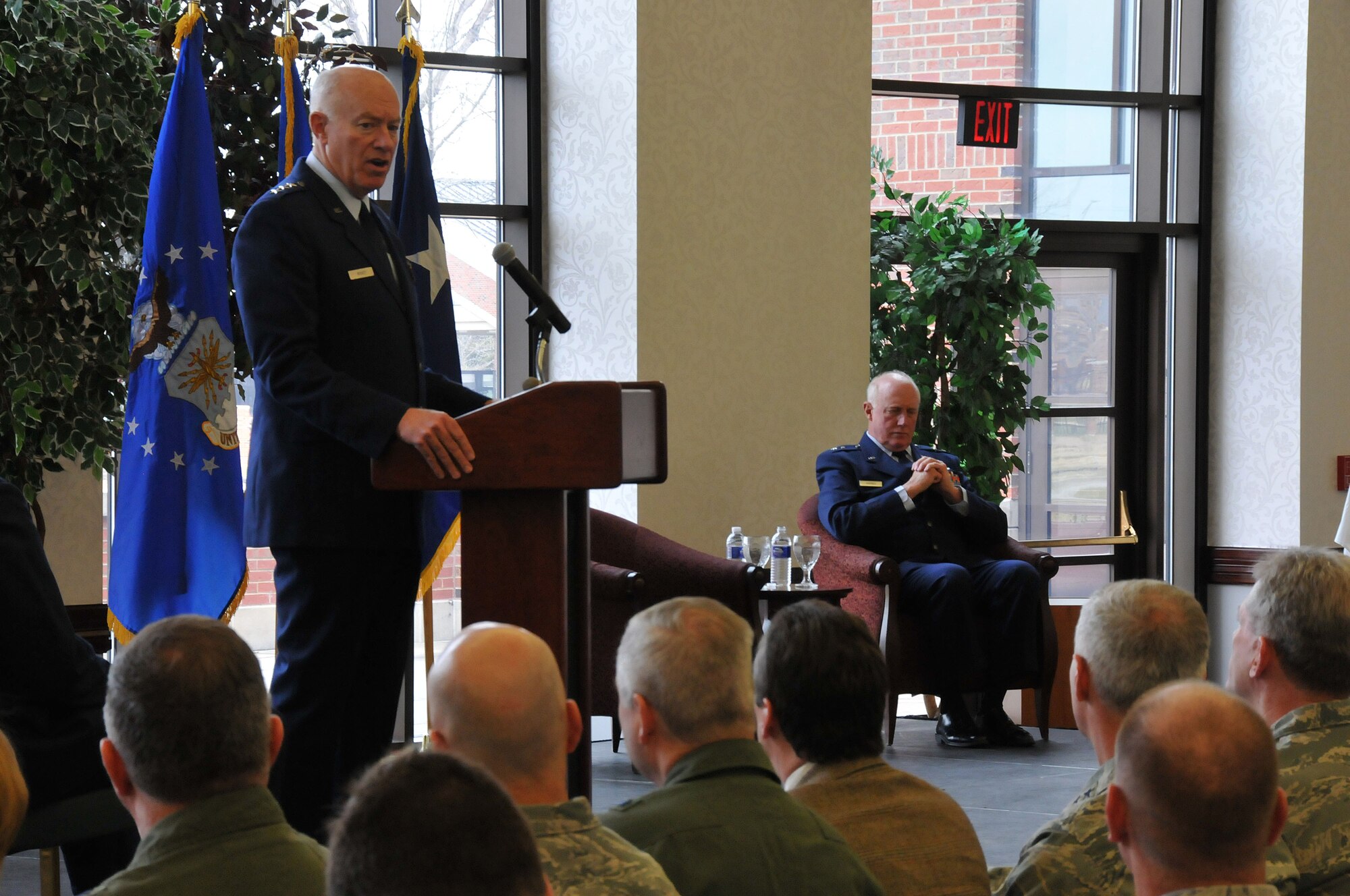 Lt. Gen. Harry M. Wyatt III (left) officiates over the retirement ceremony of Maj. Gen. Thomas J. Haynes (seated), Air National Guard Assistant to the Commander, Air Mobility Command, at Scott Air Force Base, Ill., on Jan. 27, 2012. Haynes retires with more than 40 years of service.