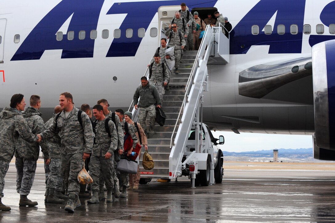 Base Leaders welcome home approximately 400 Airmen during a welcome home event on Ellsworth Air Force Base, S.D., Jan. 25, 2012. The Airmen returned home from a six-month deployment in support of operations in Southwest Asia. (U.S. Air Force photo by Airmen 1st Class Zachary Hada/Released)