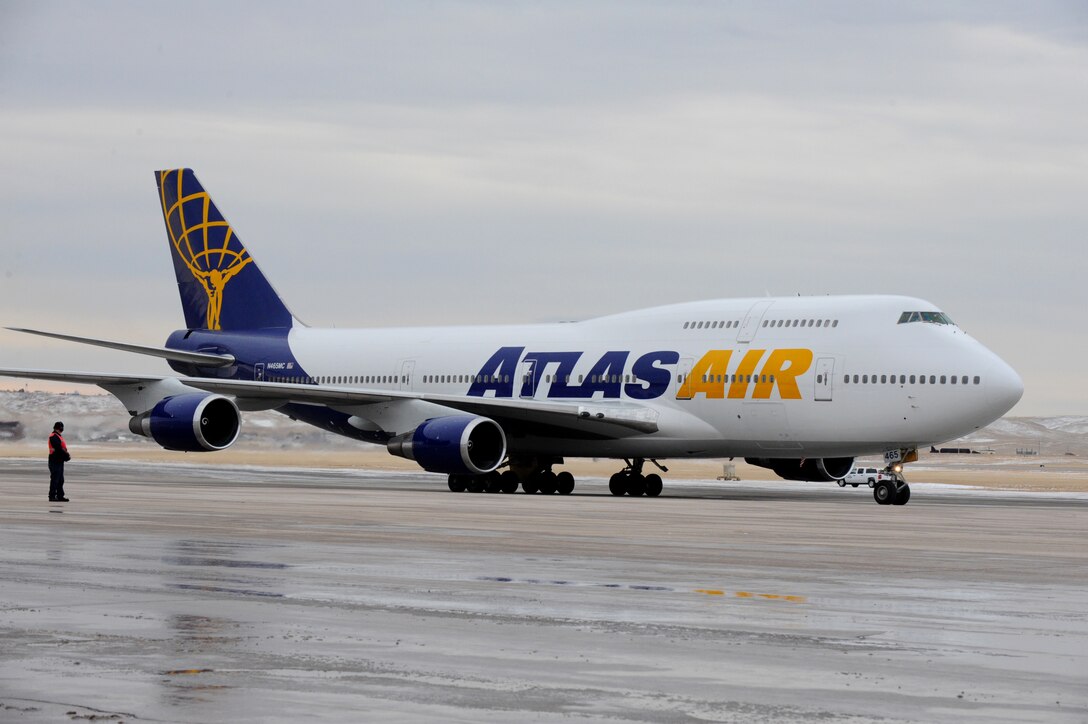 A commercial airliner carrying approximately 400 Airmen returning from a six-month deployment arrives at Ellsworth Air Force Base, S.D., Jan. 25, 2012. The Airmen supported of mission operations in Southwest Asia. (U.S. Air Force photo by Airman 1st Class Zachary Hada/Released)