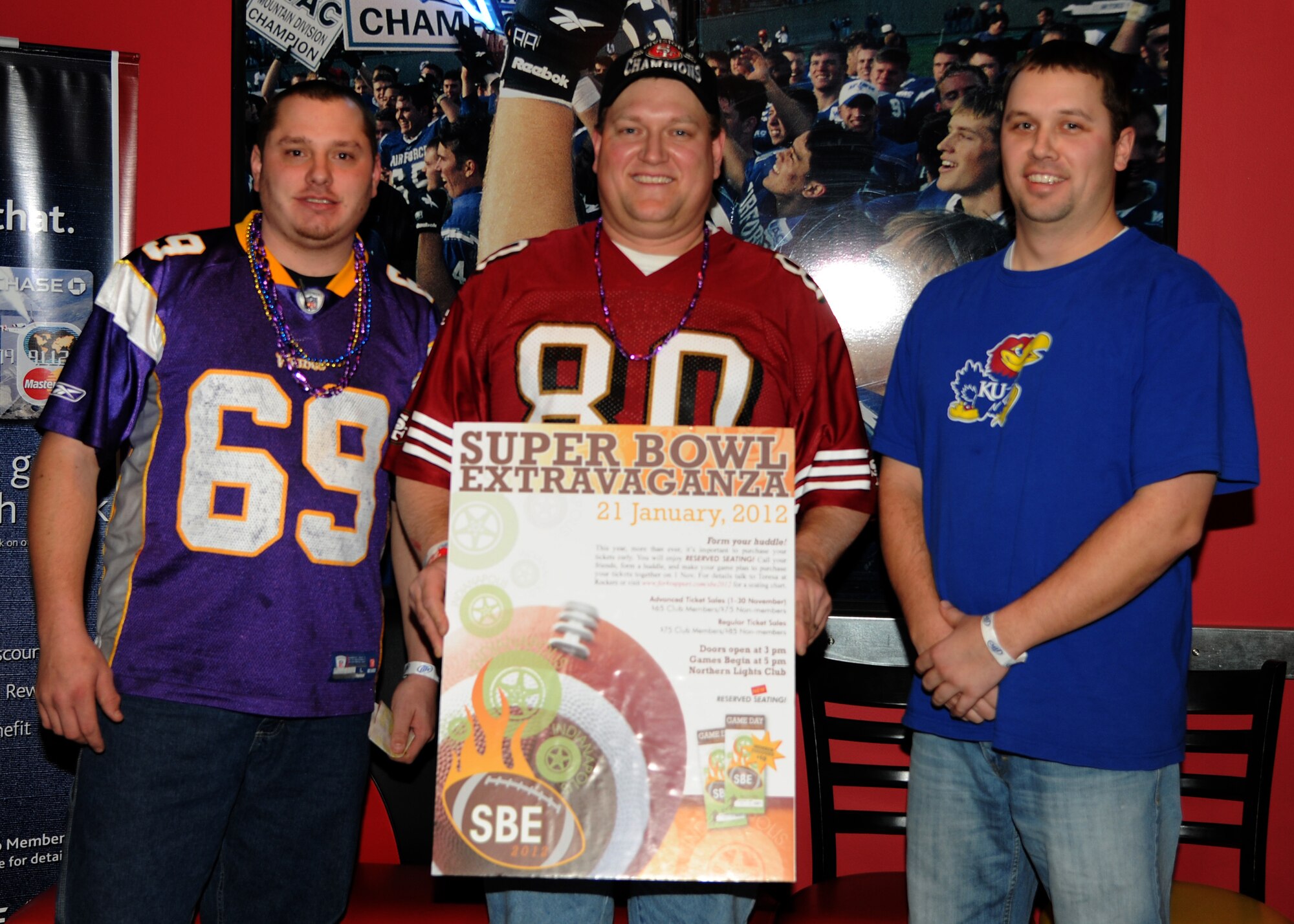 From left: Thomas Lenning, Chad Johnson and Donovan Mitchell pose after winning the grand prize of $5,000 at the 6th annual Super Bowl Extravaganza on Jan. 21, 2012, at Grand Forks Air Force Base, N.D. The three winners chose to split the prize money evenly. The 319th Force Support Squadron hosts the annual SBE to give the Grand Forks military and community members the opportunity to interact and win more than $38,000 in door prizes, including a chance to win a free trip to the Super Bowl or $5,000 cash. (U.S. Air Force photo/Airman 1st Class Ashley N. Taylor)