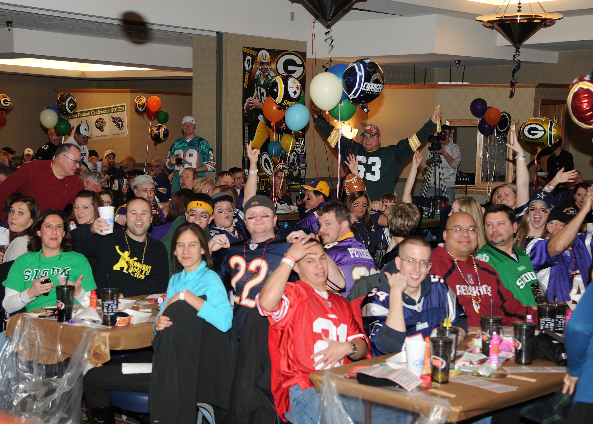 The crowd cheers during the 6th annual Super Bowl Extravaganza on Jan. 21, 2012, at Grand Forks Air Force Base, N.D.  The 319th Force Support Squadron hosts the annual SBE to give the Grand Forks military and community members the opportunity to interact and win more than $38,000 in door prizes, including a chance to win a free trip to the Super Bowl or $5,000 cash. (U.S. Air Force photo/Airman 1st Class Ashley N. Taylor)
