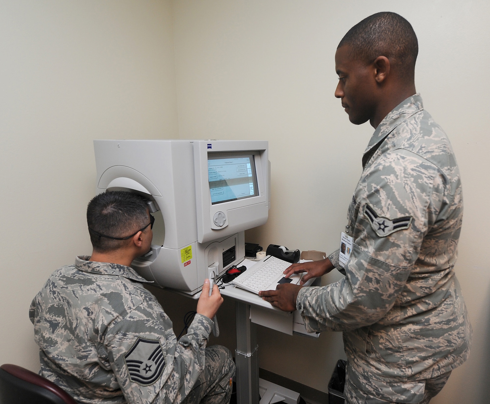 Airman 1st Class Ikeem Taylor, ophthalmic technician, performs a visual field test Jan. 26 at the David Grant USAF Medical Center Optometry Clinic. Visual field testing is most frequently used to detect any signs of glaucoma damage to the optic nerve. (U.S. Air Force photo/ Staff Sgt. Liliana Moreno)