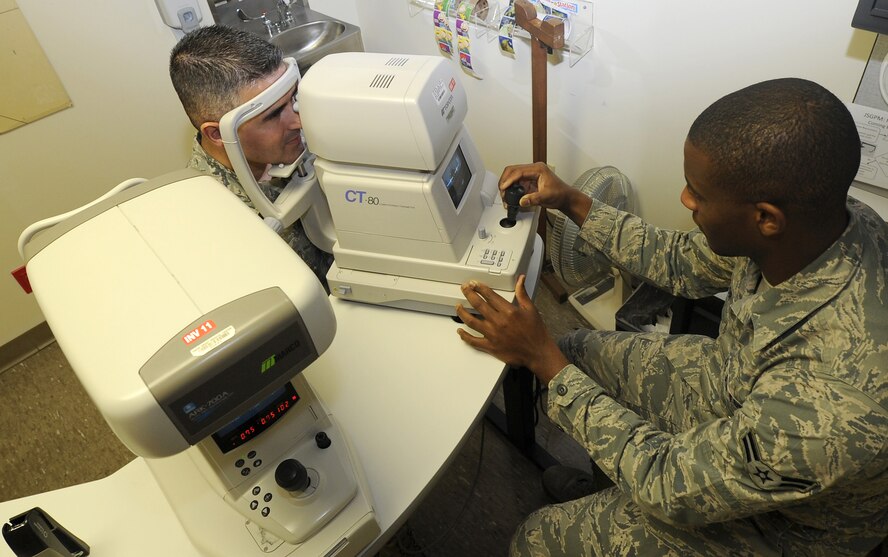 Airman 1st Class Ikeem Taylor, ophthalmic technician, performs a noncontact tonometry test Jan. 26 at the David Grant USAF Medical Center Optometry Clinic. This procedure is an important test in the evaluation of patients at risk from glaucoma. (U.S. Air Force photo/ Staff Sgt. Liliana Moreno)