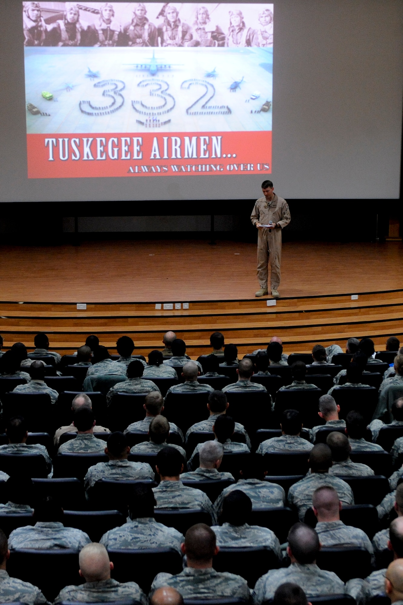 Col. Paul Beineke, 332nd Air Expeditionary Wing commander, speaks to members of the 332nd AEW prior to the "Red Tails" movie premiere at an undisclosed location in Southwest Asia, Jan. 27, 2012. The movie which premiered state side one week earlier was shown to members of the 332nd, who continue the lineage of the original Tuskegee Airmen. Beineke deployed from the Pentagon and is a native of Ames, Iowa.(U.S. Air Force photo by Staff Sgt. Joshua J. Garcia/Released)