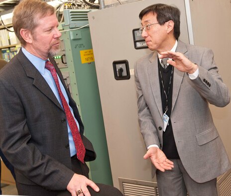 Scott Hardiman (left), Space and Nuclear Networks Division acting chief, speaks to Chao-Min King, General Dynamics Defense Injection/Reception Emergency Action Message Command and Control Terminal (DIRECT) program manager, at the contractor's facility in Needham, Mass., Jan. 9. The Electronic Systems Center recently transitioned the DIRECT program to Warner Robins Air Logistics Center, Ga., for continuing sustainment. (Photo by Steve Mason, General Dynamics C4 Systems)
