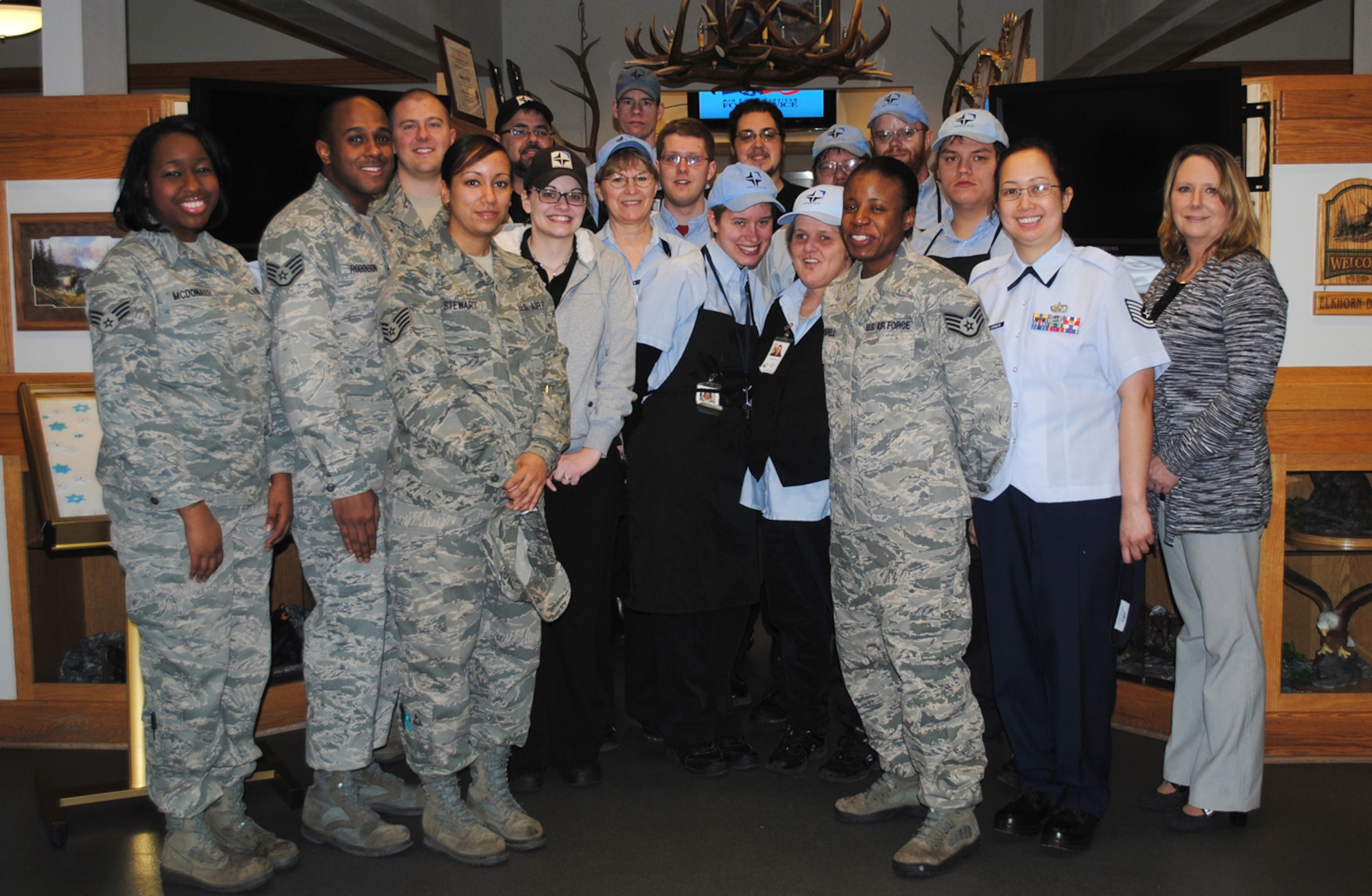 Lisa Schutz, far right, manager of the Elkhorn Dining Facility at Malmstrom, poses with the members of her staff - military and civilian contractors. The facility, its staff and its programs will undergo an evaluation Feb. 16-17 to determine this year's Air Force-level John L. Hennessy Award winner. (U.S. Air Force photo/Airman 1st Class Katrina Heikkinen)