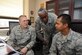 U.S. Air Force Col. Alan Metzler, left, Headquarters Air Combat Command security forces chief, and Chief Master Sgt. John Hampton, center, HQ ACC security forces manager, discuss resource management with Airman 1st Class Mark Reposar, right, 1st Operations Support Squadron air traffic control apprentice, during a Chief Shadow Day tour at Langley Air Force Base, Va., Jan. 26, 2012. This event gave Airmen an opportunity to experience the day-to-day activities of chiefs and better understand their responsibilities. (U.S. Air Force photo by Airman 1st Class Racheal Watson/Released) 