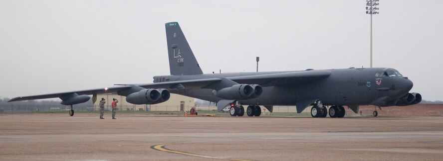 Senior Airman Kyle Matinzi and Airman 1st Class Sudarien Smith, both with the 2nd Aircraft Maintenance Squadron, salute a B-52H Stratofortress before its departure for a surge mission at Barksdale Air Force Base, La., Jan. 25. Surge missions ensure combat readiness and play an important role in the Barksdale mission. (U.S. Air Force photo/Senior Airman Kristin High)(RELEASED)