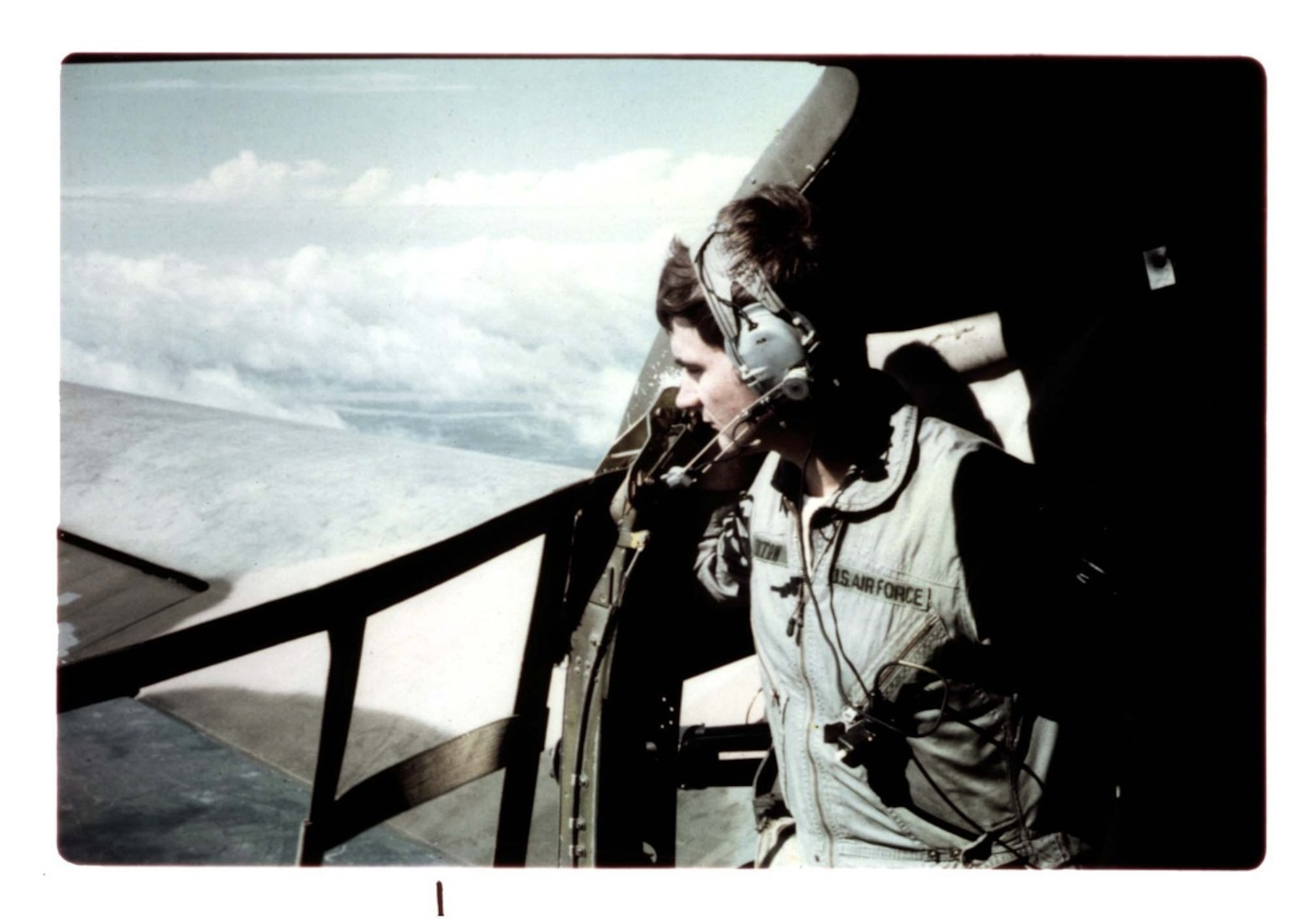 John L. Levitow is shown looking out of the aircraft in this file photo from his active-duty Air Force days as a loadmaster. (U.S. Air Force photo)