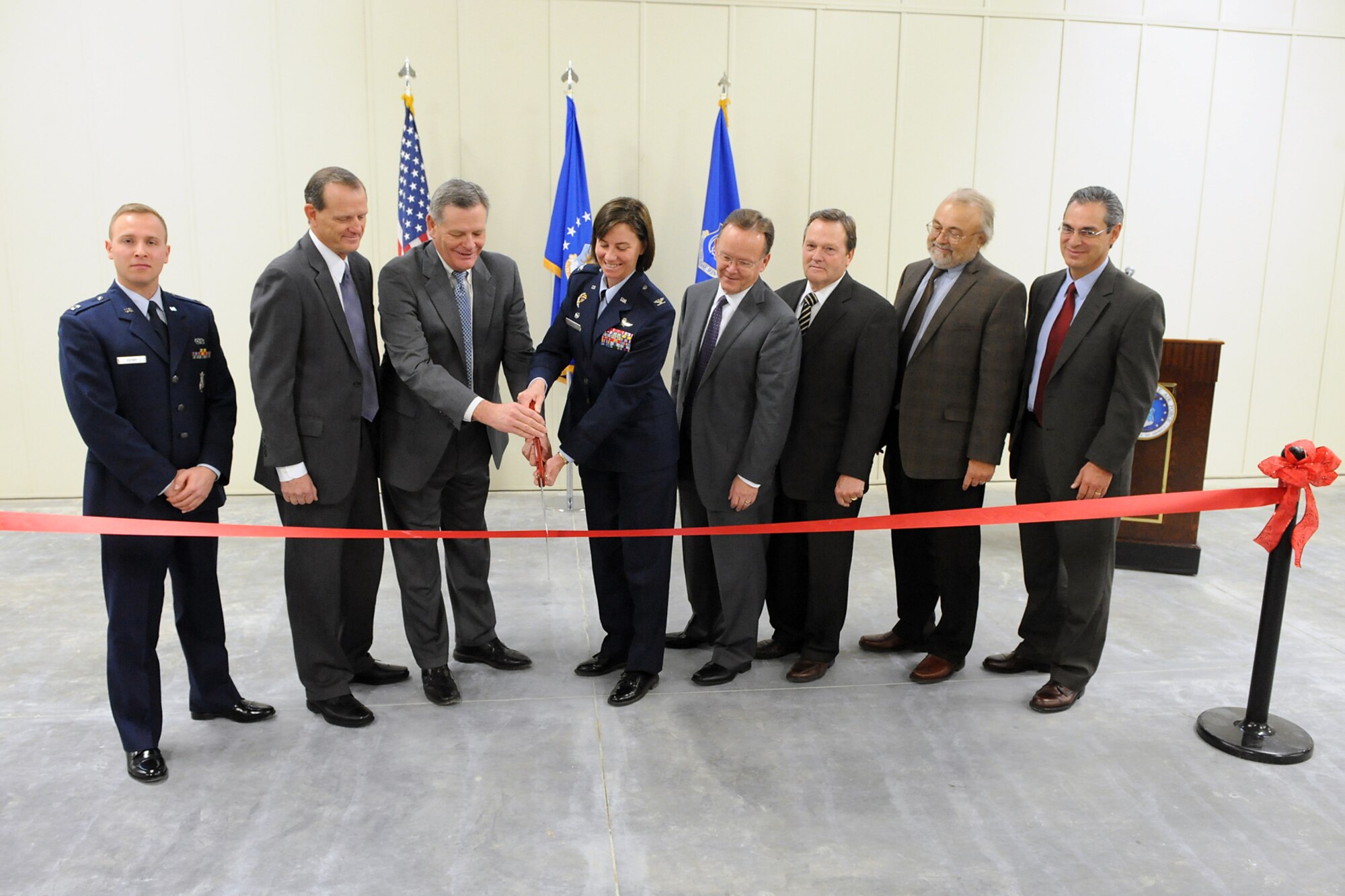 Hill Air Force Base leaders and community representatives prepare to officially open the 75th Security Forces Squadron building at Falcon Hill Jan. 18. (Left to right) they include: 75th SFS acting commander Capt. Thomas Ostby, Rep. Brad Dee (R-Ogden), Sen. Scott Jenkins (R-Weber), 75th Air Base Wing commander Col. Sarah Zabel, Sen. Stuart Adams (R-Davis), Sen. Jerry Stevenson (R-Davis), Woodbury Corp. Vice President of Development Jeff Woodbury and Hunt Senior VP Juan Gonzalez-Garza. (U.S. Air Force photo by: Alex Llyod)